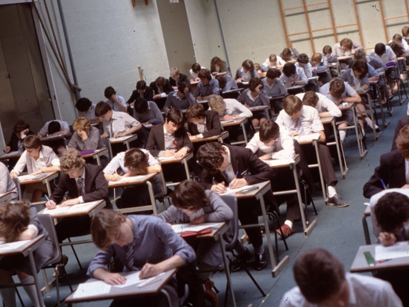 Students sitting exams in the sports hall